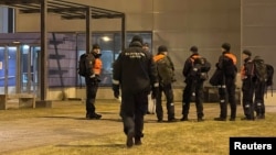 Finnish border guards wait at the Nuijamaa border checkpoint in Finland, Nov. 17, 2023.