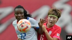 Haiti's Roselord Borgella, vies for the ball against South Korea's Lim Seon-joo during a friendly soccer match between South Korea and Haiti at Seoul World Cup Stadium in Seoul, South Korea, July 8, 2023.