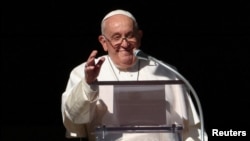 Pope Francis leads the Angelus prayer from his window, at the Vatican, Dec. 17, 2023.