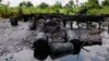 FILE- An abandoned illegal oil refinery is seen after it was raided by the Nigerian navy at Bayelsa, Nigeria, May 18, 2013. Nigerian officials have said the country loses $700 million every month as a result of oil thefts.