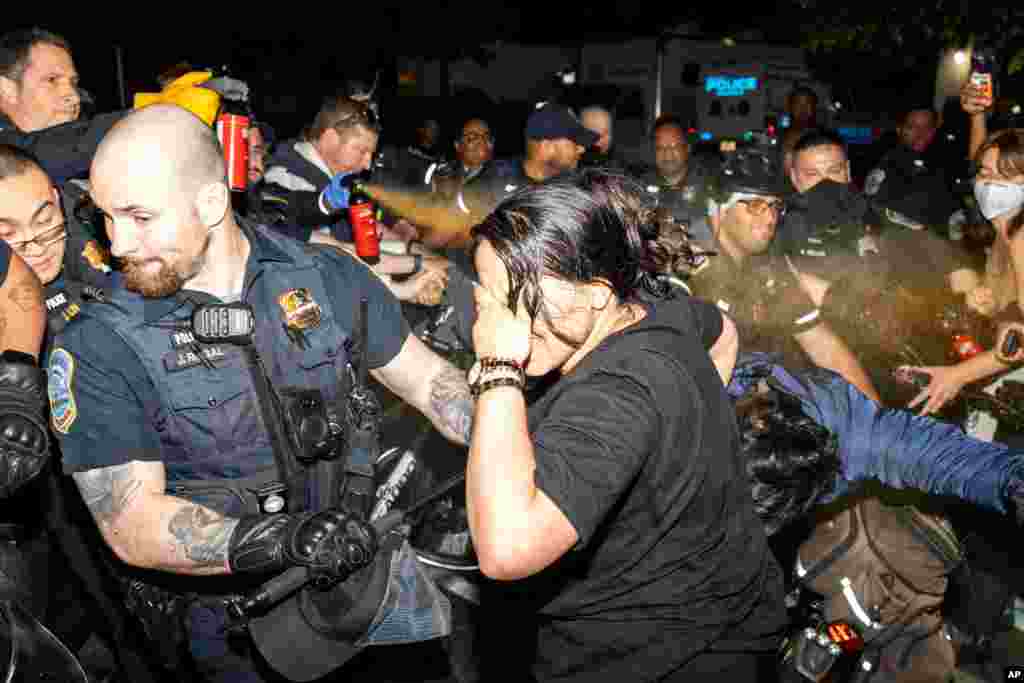 Officers of the Metropolitan Police Department pepper spray demonstrators at George Washington University, in Washington.&nbsp;Police cleared a pro-Palestinian tent encampment at George Washington University and arrested demonstrators, hours after dozens marched to the home of the school&rsquo;s president.