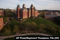 FILE - Woodburn Hall on West Virginia University's downtown campus is shown April 24, 2015, in Morgantown, W. Virginia. (AP Photo/Raymond Thompson, File)