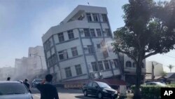 In this image taken from a TVBS video, a partially collapsed building is seen in Hualien, Taiwan, April 3, 2024. An earthquake rocked Taiwan Wednesday, collapsing buildings and creating a tsunami that washed ashore on Japanese islands. (TVBS via AP)