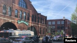 Louisville Metro Police deploy for an "active police situation" that includes mass casualties near Slugger Field in Louisville, Kentucky, April 10, 2023.