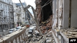 This photograph taken on Dec. 31, 2023, shows a heavily damaged building following an early morning Russian drone attack in Kharkiv, Ukraine.