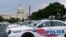 FILE - Washington Metropolitan Police Department vehicles are pictured on the perimeter of the Capitol, Aug. 26, 2021. 