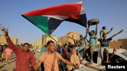 Protesters march during a rally marking the fourth anniversary of the April uprising, in Khartoum, Sudan, April 6, 2023. 