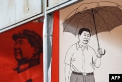 资料照：北京街头宣传习近平的宣传画。（2018年2月26日）