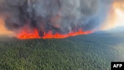 This June 8, 2023, still image from a video by British Columbia Wildfire Service shows an aerial view of the West Kiskatinaw River wildfire located 10 kilometers east of Tumbler Ridge, Canada. (AFP/BC Wildfire Service/Handout)