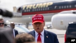 Republican presidential candidate former President Donald Trump speaks after arriving in Atlanta, April 10, 2024.