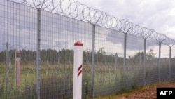 FILE - The Latvia/Belarus border near Krivanda, Eastern Latvia, is pictured on Aug. 8, 2023. Estonia, Latvia and Lithuania agreed Jan. 19, 2024, to construct new installations on their borders over the coming years to deter military threats.