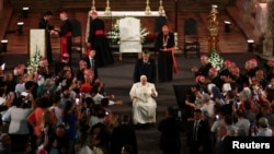 Pope Francis greets the faithful as he leaves after leading evening prayer with members of the clergy at the Mosteiro dos Jeronimos (Jeronimos Monastery) during his trip to Portugal on World Youth Day, in Lisbon, Aug. 2, 2023. 