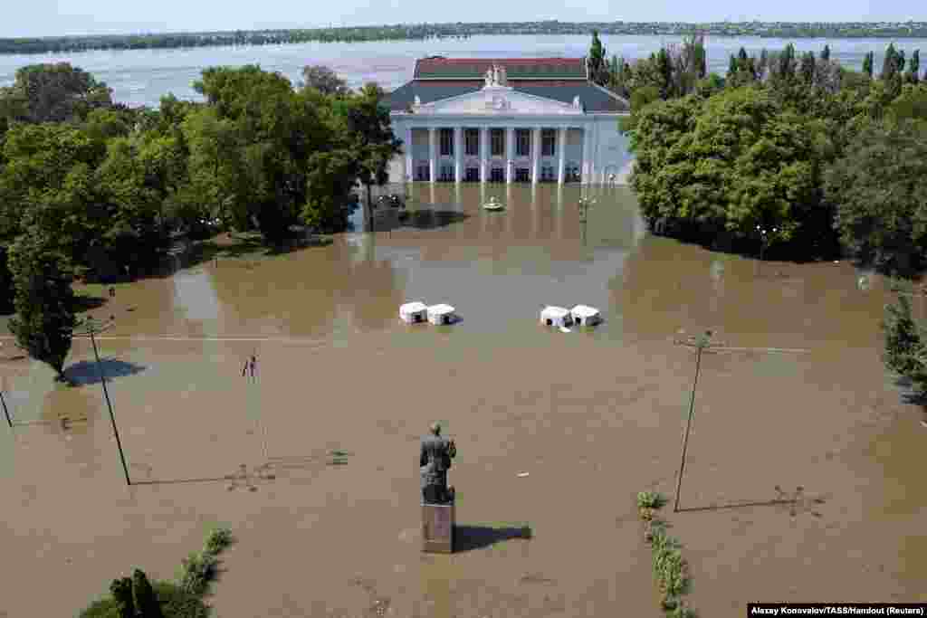 A view shows the House of Culture on a flooded street in Nova Kakhovka after the nearby dam was breached in the course of Russia-Ukraine conflict, in the Kherson Region, Russian-controlled Ukraine, June 6, 2023.