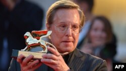 FILE - William Friedkin poses on the red carpet after receiving the Golden Lion for Lifetime Achievement during the Venice Film Festival on Aug. 29, 2013. Friedkin, Oscar-winning director of "The French Connection" and "The Exorcist," died Aug. 8, 2023. 