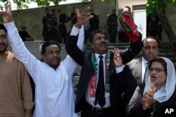 Lawyers and supporters of Pakistani imprisoned former Prime Minister Imran Khan react after court decision in Islamabad, Pakistan, Aug. 29, 2023.
