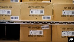 FILE - Boxes containing Yeezy shoes made by Adidas are seen at Laced Up, a sneaker resale store, in Paramus, N.J., Tuesday, Oct. 25, 2022.