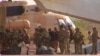 FILE - This undated photograph provided by the French military shows Russian mercenaries boarding a helicopter in northern Mali. 