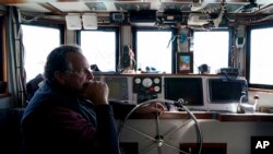 FILE - Bob Maharry sits in his boat in San Francisco, California, March 20, 2023. California officials want federal disaster aid for the state's salmon fishing industry due to the closure of recreational and commercial king salmon fishing seasons along much of the West Coast.
