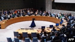 Members of the Security Council vote on a resolution regarding the situation in Israel and Gaza at a council meeting on the situation in the Middle East, at the United Nations, Oct. 18, 2023, in New York. 