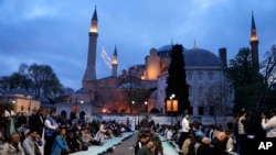 Muslims attend the prayer of the first day of Eid al-Fitr, outside the iconic Haghia Sophia mosque in the historic Sultan Ahmed district of Istanbul, Turkey, Apr. 10, 2024.