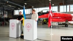 Ukrainian President Volodymyr Zelenskyy and Denmark's Prime Minister Mette Frederiksen speak at a press conference at Skrydstrup Airbase in Vojens, Denmark, Aug. 20, 2023. (Ritzau Scanpix/Mads Claus Rasmussen via Reuters)