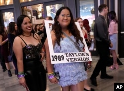 Karen Boncan, left, and Petrushka Seville arrive at the world premiere of the concert film "Taylor Swift: The Eras Tour" on Wednesday, Oct. 11, 2023, at AMC The Grove 14 in Los Angeles. (AP Photo/Chris Pizzello)