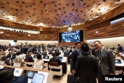 Delegates attend the 77th World Health Assembly of the World Health Organization (WHO) at the United Nations in Geneva, Switzerland, May 27, 2024.