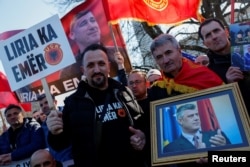Supporters of former Kosovo President Hashim Thaci protest on the first day of his war crimes trial, in The Hague, Netherlands, April 3, 2023.