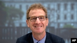 FILE - Andrew Hampton, New Zealand's Director-General of the Government Communications Security Bureau poses for a photo at Defence House in Wellington, on March 23, 2022.