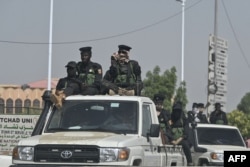 FILE - Chad police officers patrol the streets in N'Djamena on May 10, 2024, a day after the announcement of the results of Chad's presidential election.