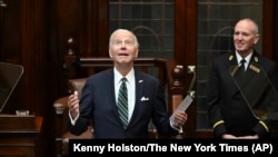 U.S. President Joe Biden looks up as he addresses members of the Irish parliament at Leinster House in Dublin, April 13, 2023.