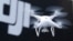 FILE - A Phantom 4, developed by Chinese consumer drone maker DJI, is pictured during a demonstration flight in Tokyo, March 3, 2016.