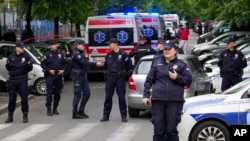 Police block streets around the Vladislav Ribnikar school in Belgrade, Serbia, May 3, 2023.