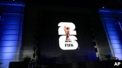FILE - The logo for the 2026 World Cup is shown on a screen outside Griffith Observatory in Los Angeles on Wednesday, May 17, 2023. A unique 2030 World Cup is set to be played in Europe and Africa.