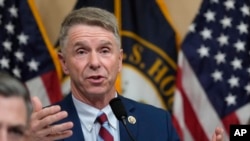 FILE - US Rep. Rob Wittman questions witnesses during a hearing of a special House committee dedicated to countering China, on Capitol Hill, on Feb. 28, 2023, in Washington. 