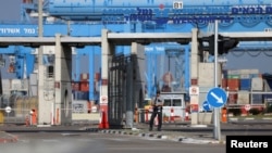 A man stands guard at Ashdod Port in Ashdod, Israel, April 5, 2024.