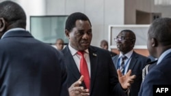 FILE - Zambian President Hakainde Hichilema, center, is pictured in Addis Ababa, Ethiopia, Feb. 19, 2023. Hichilema enacted the Access to Information law in December, 2023, more than 20 years since it was first introduced in parliament. 