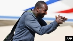 French journalist Olivier Dubois, who was held hostage in Mali for nearly two years by the Support Group for Islam and Muslims, reacts as he arrives at an airport near Paris, March 21, 2023.