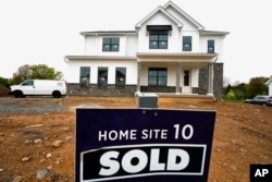 FILE - A home under construction is marked as "sold" at a development in Eagleville, Pennsylvania, April 28, 2023.