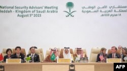 A handout picture provided by the Saudi Press Agency (SPA) on Aug. 6, 2023 shows Saudi Arabia's National Security advisor and Minister of State Musaad bin Mohammed al-Aiban (C) speaking during a National Security advisors' meeting in Jeddah. 
