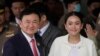 FILE - Thailand's former Prime Minister Thaksin Shinawatra, with his daughter Paetongtarn, arrives at Don Muang airport in Bangkok, Aug. 22, 2023. Paetongtarn Shinawatra. On Sunday she formally became Thailand's 31st prime minister.