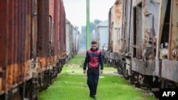 FILE - An Iraqi man walks at a Mosul train station in the northern Iraqi city on February 1, 2020. 