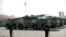 FILE - Chinese military vehicles carrying DF-17 ballistic missiles roll during a parade to commemorate the 70th anniversary of the founding of Communist China in Beijing, on Oct. 1, 2019.