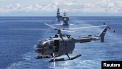 FILE = An Indonesian navy helicopter takes off from a ship during the Komodo Exercise 2016, a 5-day multinational exercise, near the Mentawai Islands off the coast of West Sumatra, Apr. 14, 2016. (Reuters/Akbar Nugroho Gumay/Antara Foto)