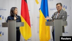 German Foreign Minister Annalena Baerbock and Ukrainian Foreign Minister Dmytro Kuleba attend a joint press conference following their talks in Kyiv, Ukraine, Sept. 11, 2023.
