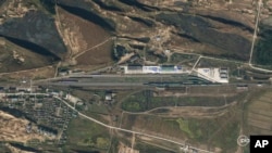 This satellite photo from Planet Labs PBC shows increased activity at the Tumangang Rail Facility in North Korea on Oct. 5, 2023. (Planet Labs PBC via AP)