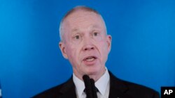 FILE - Israeli Defense Minister Yoav Gallant speaks at Ben Gurion International Airport, March 9, 2023, in Lod, Israel. He visited Azerbaijan July 13, 2023, where he sought to bolster ties between countries that are both foes of Iran.