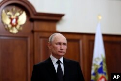 Russian President Vladimir Putin addresses the nation, in Moscow, Russia, June 24, 2023, and vowed to defend the country and its people from an armed rebellion by Yevgeny Prigozhin.