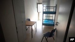 A view inside a standard two-bed room inside a shelter for new asylum seekers near the central registration in Berlin, Germany, Sept. 25, 2023.