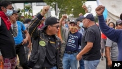 Protesters demanding the resignation of Attorney General Consuelo Porras block the Inter-American Highway in San Lucas Sacatepéquez, Guatemala, FOct. 13, 2023. 